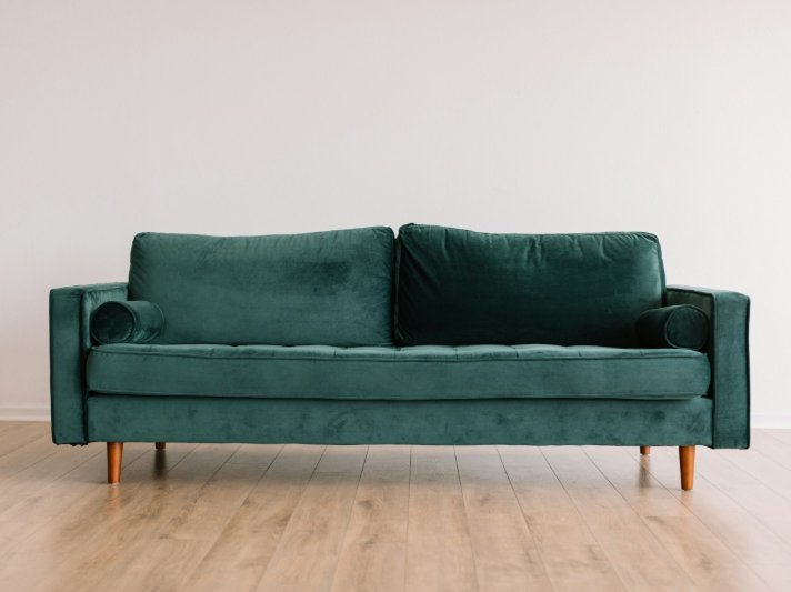 Yellow couch on vinyl plank flooring